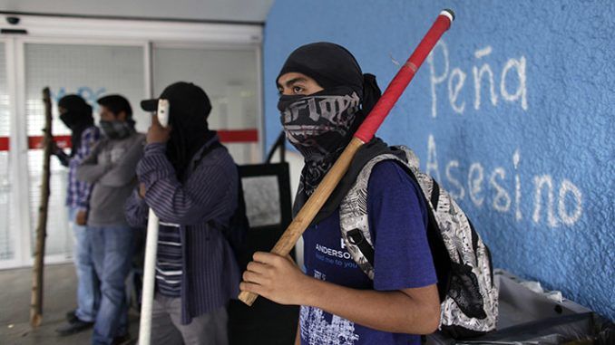 Mexican protesters set fire to regional party HQ over 43 missing students