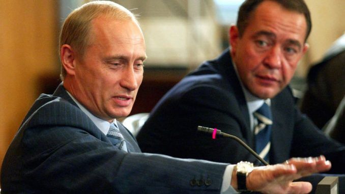 An associate of Russian President Vladimir Putin, Mikhail Lesin (pictured right), has been found dead in a hotel under suspicious circumstances