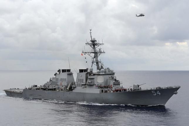 China accuses the U.S. government of breaking the law as one of their warships passes by the South Sea China islands