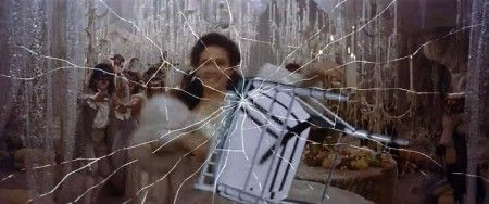 To escape the ball, Sarah must shatter a mirror – a symbolic image representing the fracture of her personality. 
