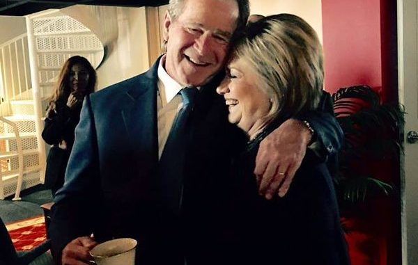 Theater of politics encapsulated in a photograph as Hillary Clinton and George W. Bush embrace at Nancy Reagan's funeral service