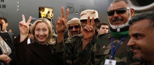 Hillary Clinton with Libyan soldiers in October 2011