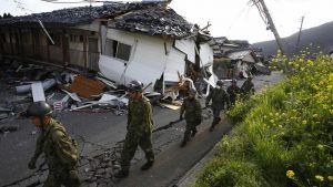 Japan forces survey damage