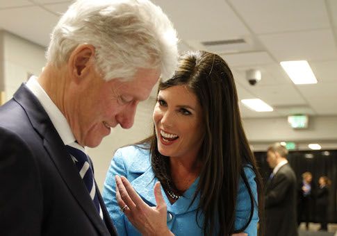Bill Clinton autographs items as Kathleen Kane, then democratic candidate for Pennsylvania Attorney General, spoke at Upper Moreland High School in 2012. Bill Clinton endorsed Kane earlier that day. 