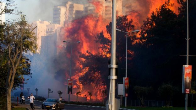 Huge flames roared between apartment blocks as residents fled 