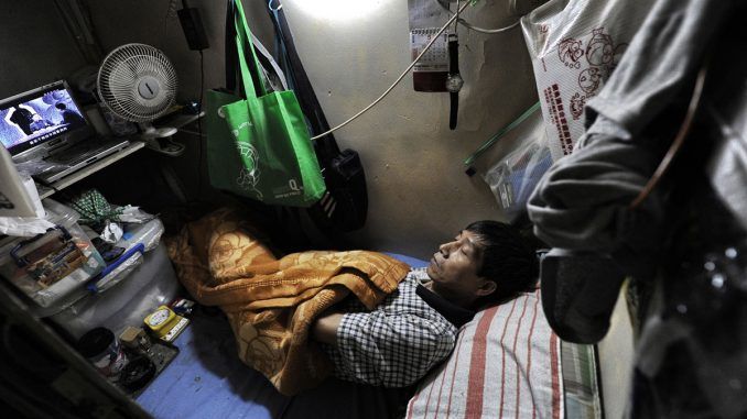 Hong Kong resident live in 'coffin homes' as housing crisis worsens
