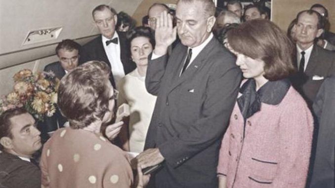 Jackie Onassis wore her bloodstained dress to Lyndon B. Johnson's emergency swearing in ceremony “ to shame" him, according to the JFK files.