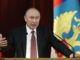 Vladimir Putin warns dark forces are conspiring to bring down President Trump