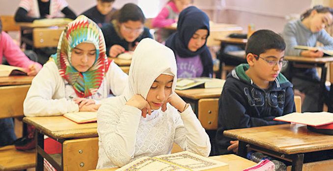 A German school headmaster in Frankfurt-am-Main told the mother of a student she should dress her daughter in a hijab, or Muslim head covering, so that Muslim students would stop bullying the girl.