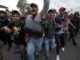 Mexican Police were fired upon by two armed Honduran migrants this week as they attempted to provide security for the notoriously unsafe caravan. 