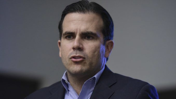 Puerto Rico's governor issued a threat to President Trump during a CNN interview Thursday, vowing to punch him in the mouth.