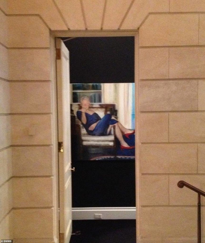 Jeffrey Epstein had a bizarre portrait of Bill Clinton hanging in his Manhattan mansion, depicting the former president lounging on a chair in the Oval Office wearing red heels and an open-necked blue dress