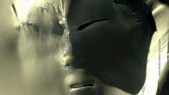 A satellite image from Google Earth shows a massive grey alien face in Antarctica, according to UFO enthusiasts, with some of them claiming the face was made by an ancient alien race that lived in Antarctica.