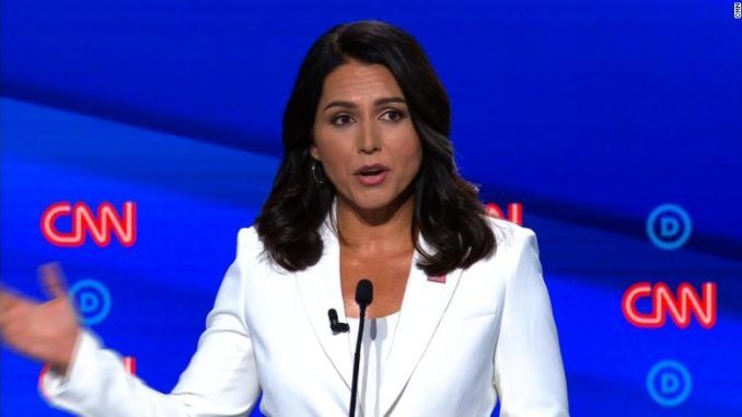 Rep. Tulsi Gabbard, a Democratic presidential candidate, said the U.S. should drop criminal charges against WikiLeaks editor Julian Assange and pardon Edward Snowden.