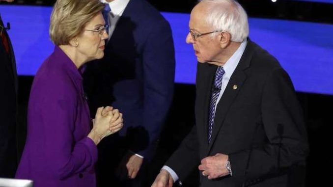 Elizabeth Warren was caught on a hot mic seconds after Tuesday's Democrat debate accusing Bernie Sanders of calling her a liar.