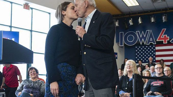 Creepy Joe Biden gave his teenage granddaughter a kiss on the lips while clutching her hand as a crowd of Democrats watched at a campaign event ahead of the upcoming Iowa caucuses.