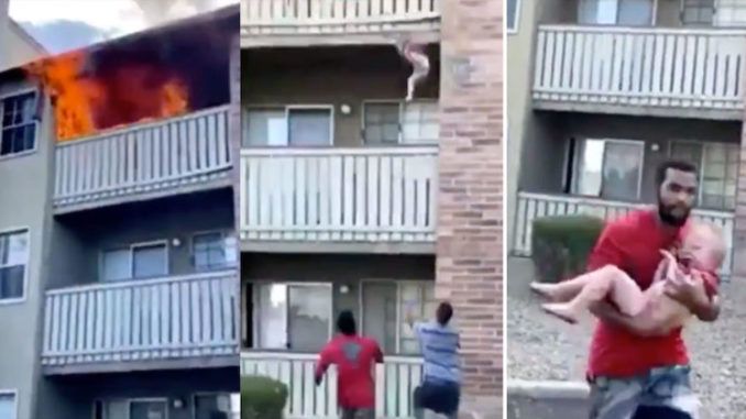 A former Marine and college wide receiver heroically saved the life of a 3-year-old boy by catching him after he was thrown from a burning building by his mother, dramatic cellphone footage shows.