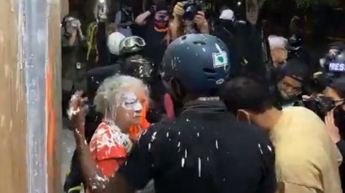 Violent Antifa rioters in Portland attacked an elderly woman who was using a walker after she attempted to stop the rioters burning down the East Precinct building of the Portland Police Department.