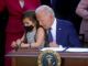 President Joe Biden grabs little girl during bill signing at the White House