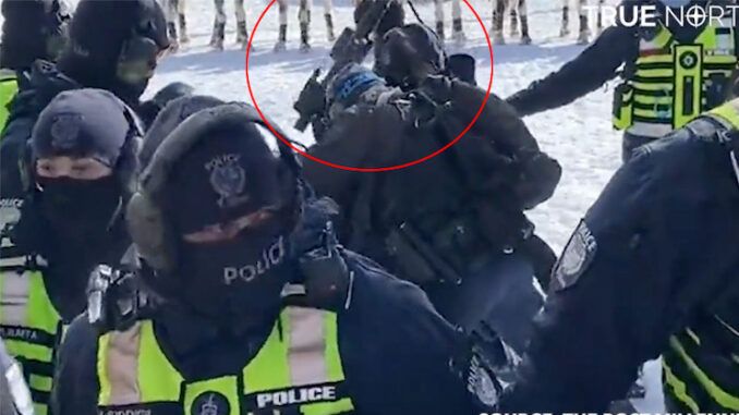 Justin Trudeau's goons caught beating a protestors with the back of a rifle